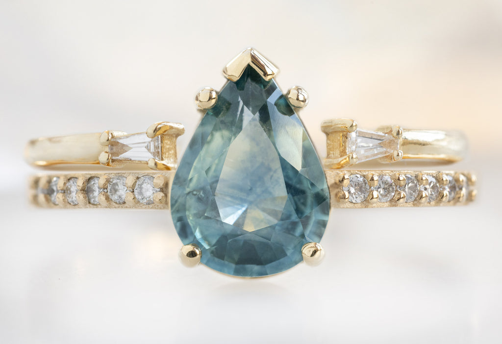 The Willow Ring with a Pear-Cut Montana Sapphire with Open Cuff Baguette Stacking Band