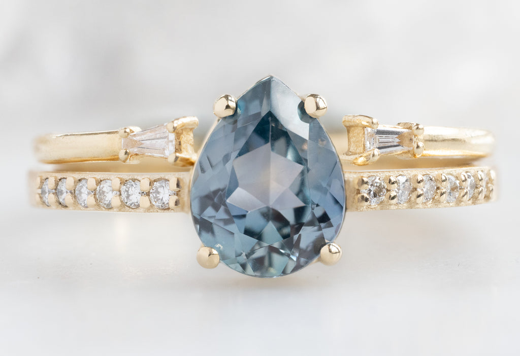 The Willow Ring with a Pear-Cut Montana Sapphire with Open Cuff Baguette Stacking Band