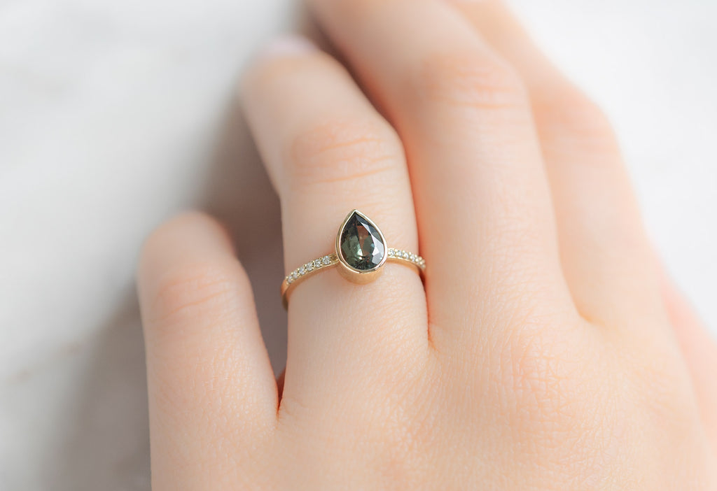 The Willow Ring with a Pear-Cut Sapphire on Model