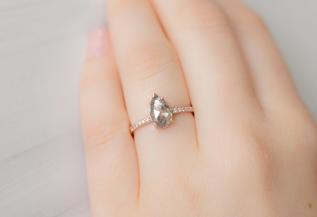 The Willow Ring with a Pear-Cut Silvery Grey Diamond on Model