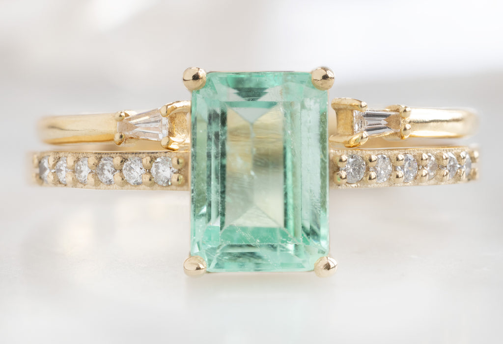The Willow Ring with an Emerald-Cut Emerald with Open Cuff Baguette Diamond Stacking Band