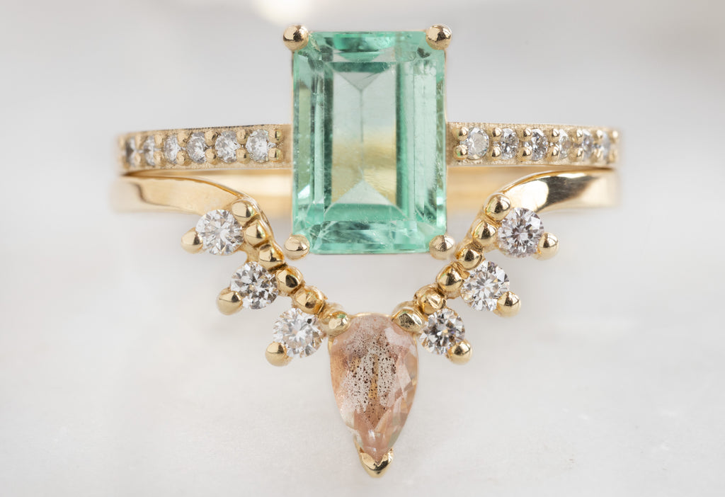 The Willow Ring with an Emerald-Cut Emerald with Sunstone and White Diamond Sunburst Stacking Band