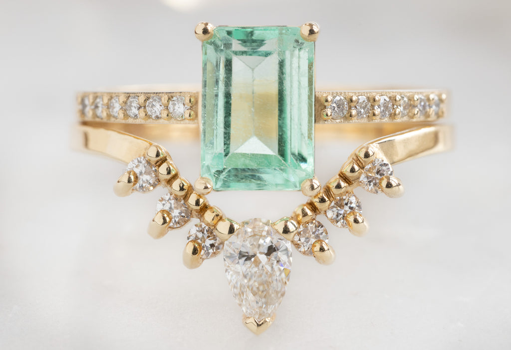 The Willow Ring with an Emerald-Cut Emerald with White Diamond Sunburst Stacking Band