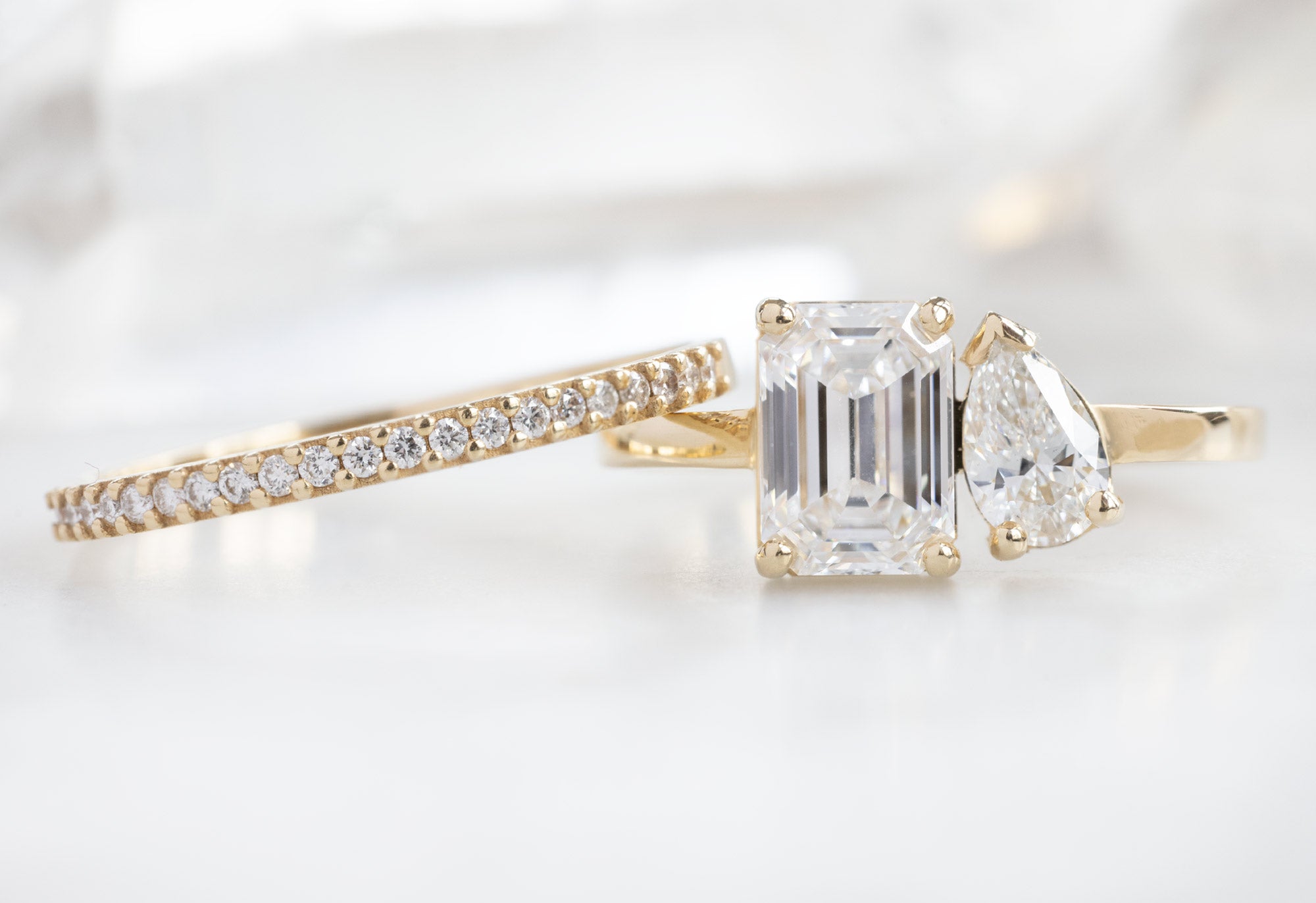 The You & Me Ring with an Emerald-Cut Lab Grown + White Diamond with Pavé Diamond Stacking Band
