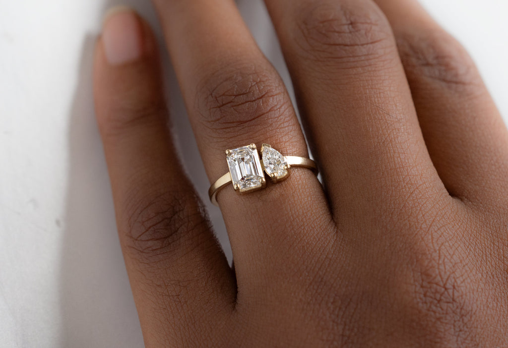 The You & Me Ring with an Emerald-Cut Lab Grown + White Diamond on Model