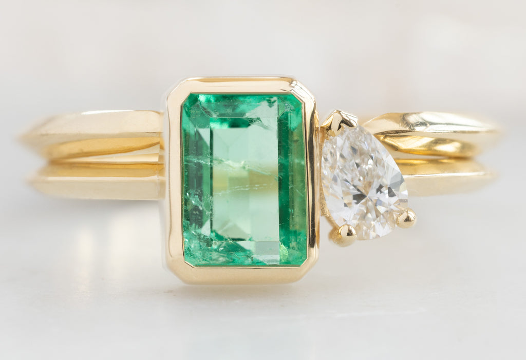 The You & Me Ring with an Emerald + White Diamond with Open Cuff Knife-Edge Stacking Band