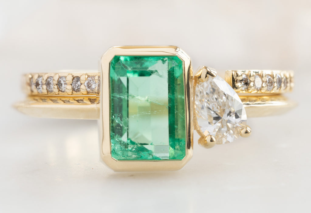 The You & Me Ring with an Emerald + White Diamond with Open Cuff Pavé Diamond Band