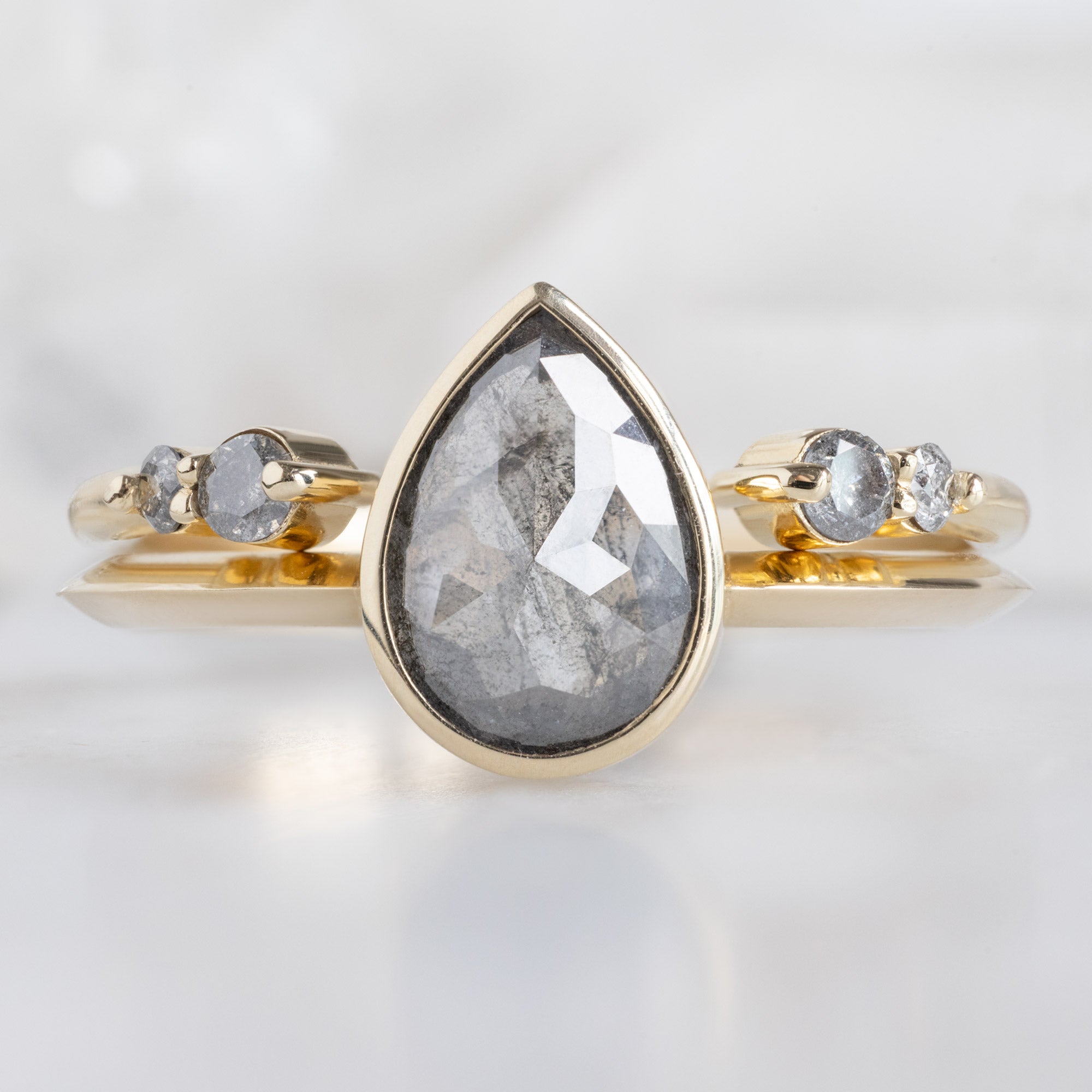 The Luxe Open Cuff Salt and Pepper Round Diamond Stacking Band in 14K Yellow Gold stacked with diamond engagement ring