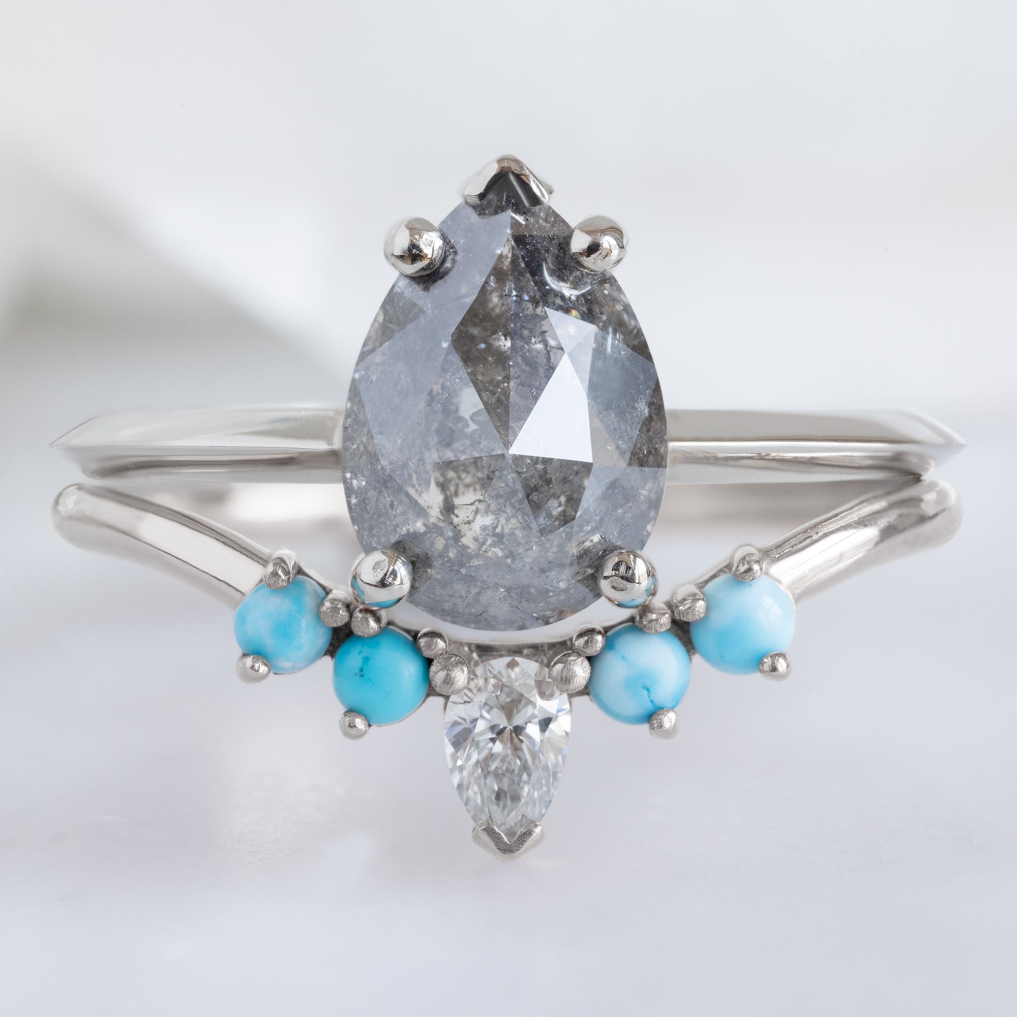White Diamond and Turquoise 4-Stone Sunburst Stacking Band in 14K Yellow Gold Stacked with Black Diamond Pear Engagement Ring