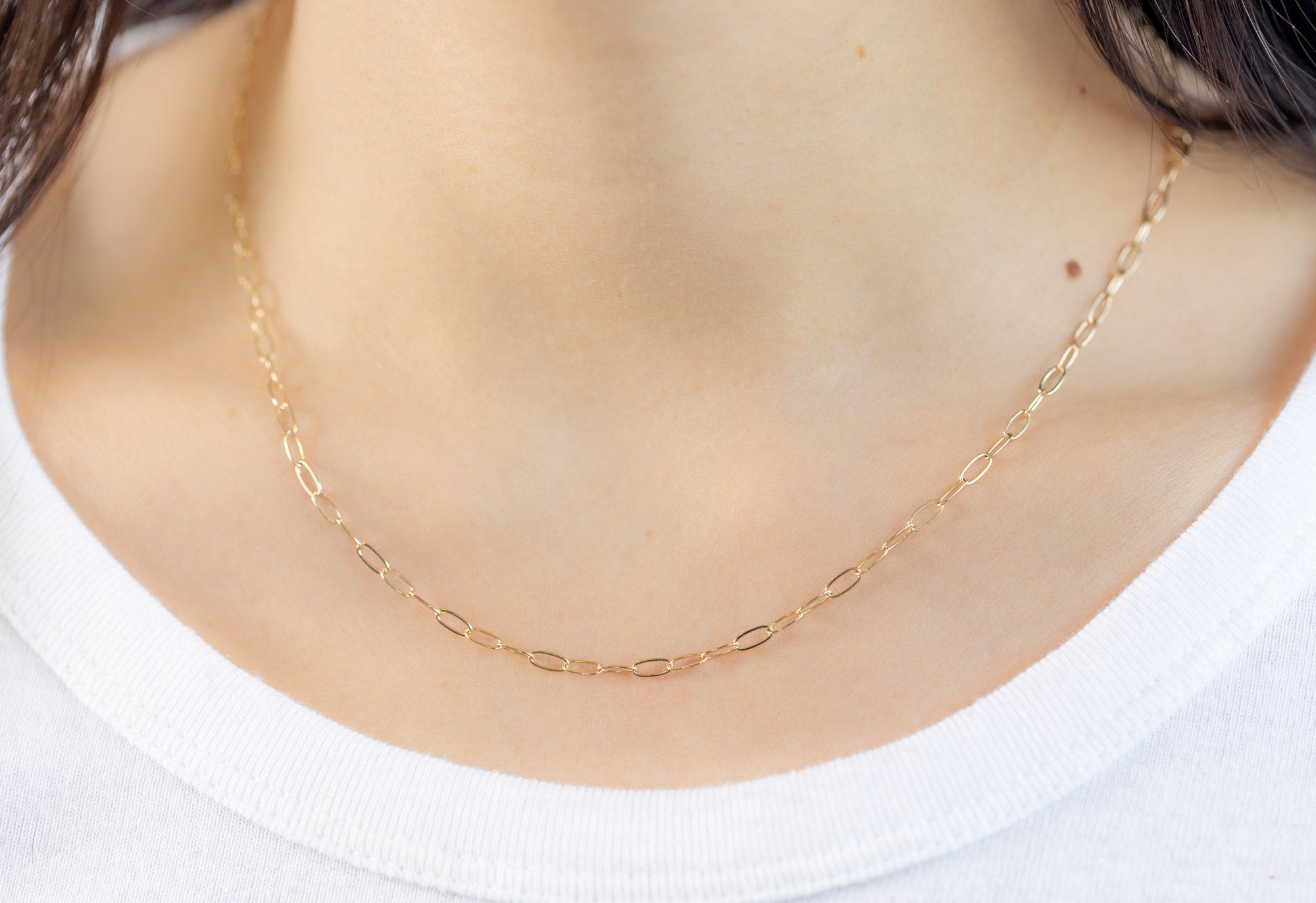 Yellow Gold Drawn Cable Chain Charm Necklace on Model wearing white boatneck shirt