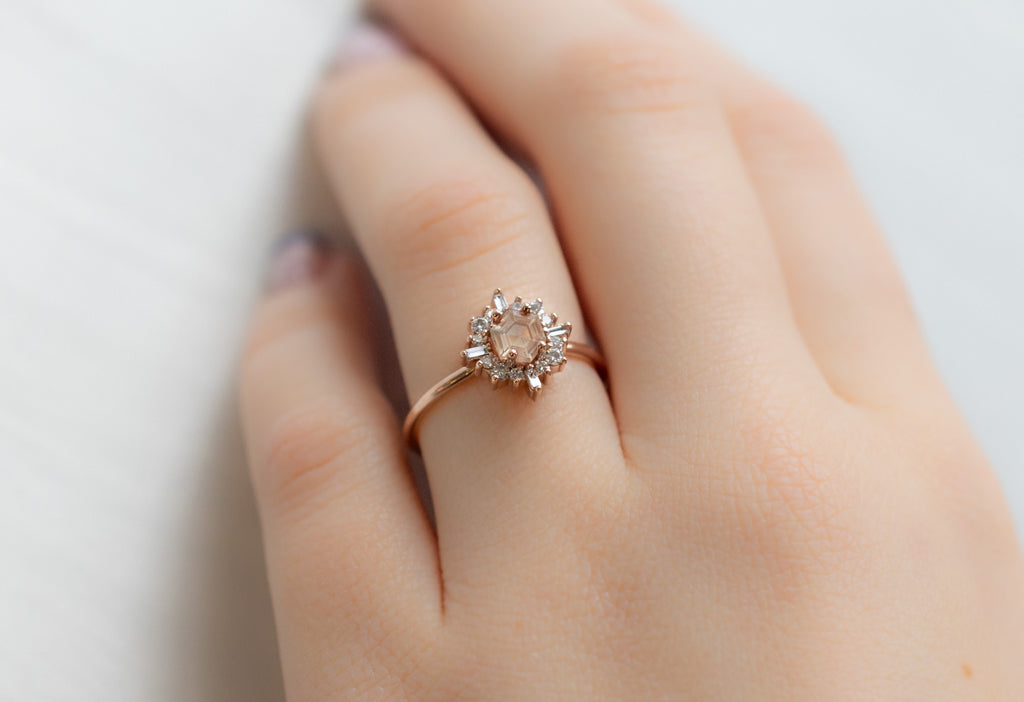 The Compass Ring with a Hexagon-Cut Sunstone on Model