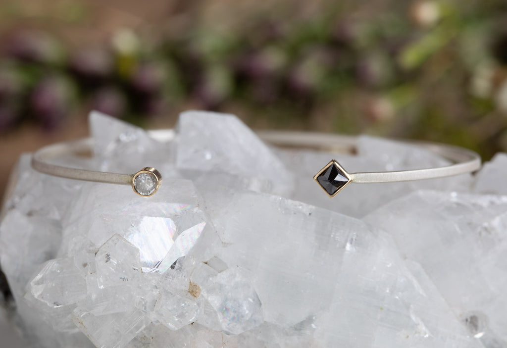 open cuff black and white diamond bracelet on white crystal