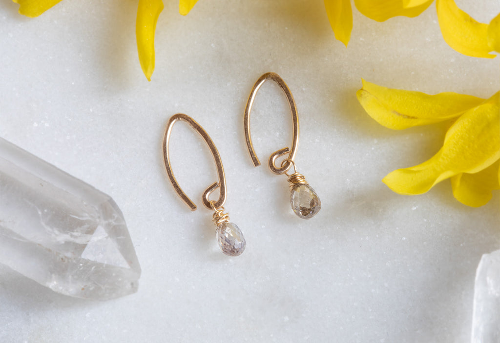 Yellow Gold Champagne Diamond Simple Diamond Drop Earrings with yellow flower petals in background