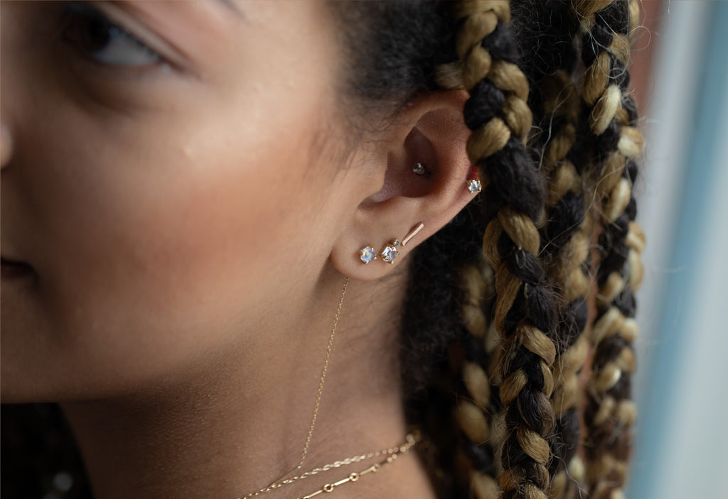 Hexagon Moonstone Thread Earrings Stacked on Model