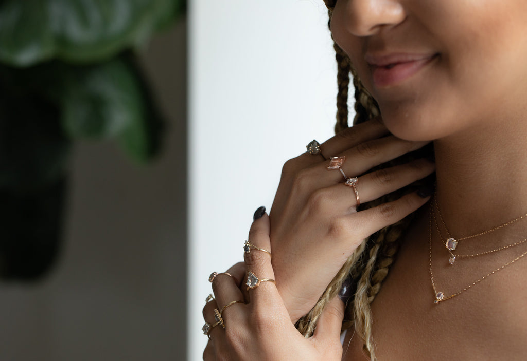 model wearing all Alexis Russell Jewelry including engagement rings and necklaces