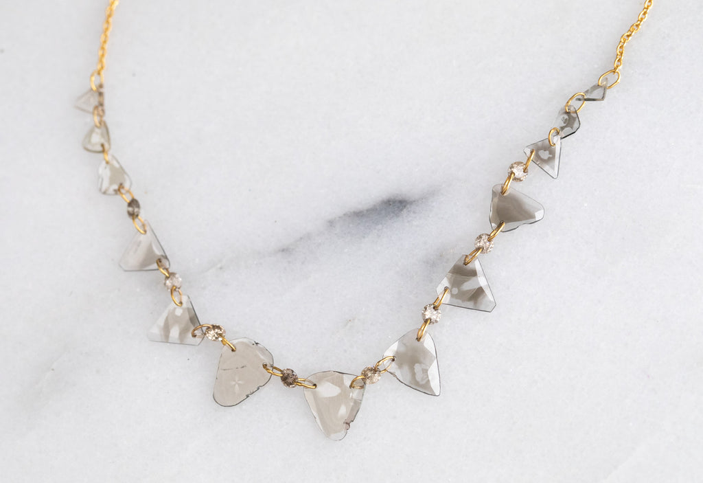 Yellow Gold Diamond Slice Pennant Necklace on White Marble Tile