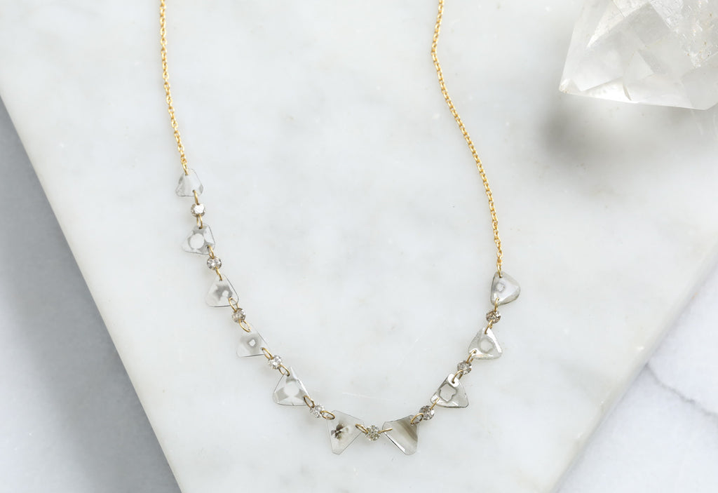 Yellow Gold Diamond Slice Pennant Necklace on White Marble Tile