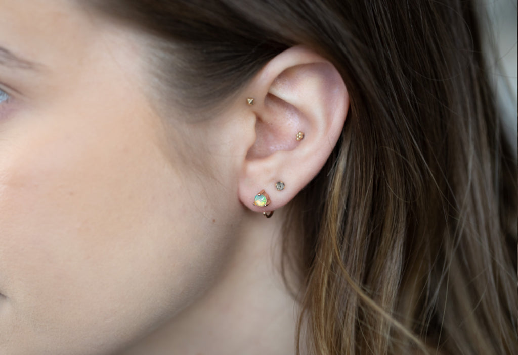 Opal Huggie Stud Earrings on model