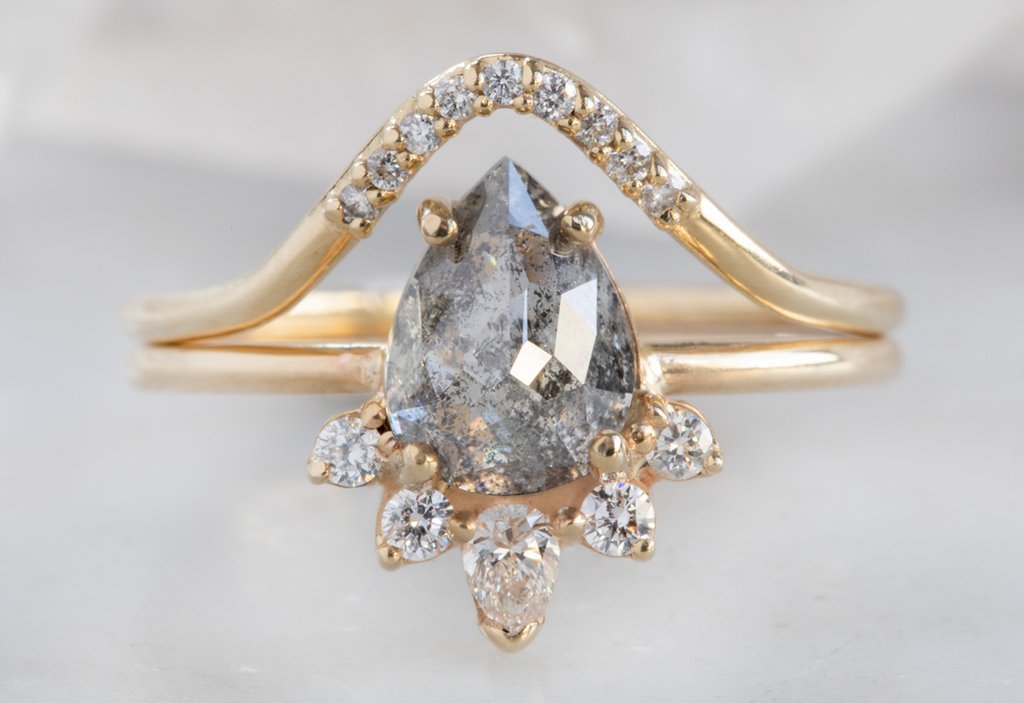 yellow gold pavé peak diamond stacking band with diamond engagement ring