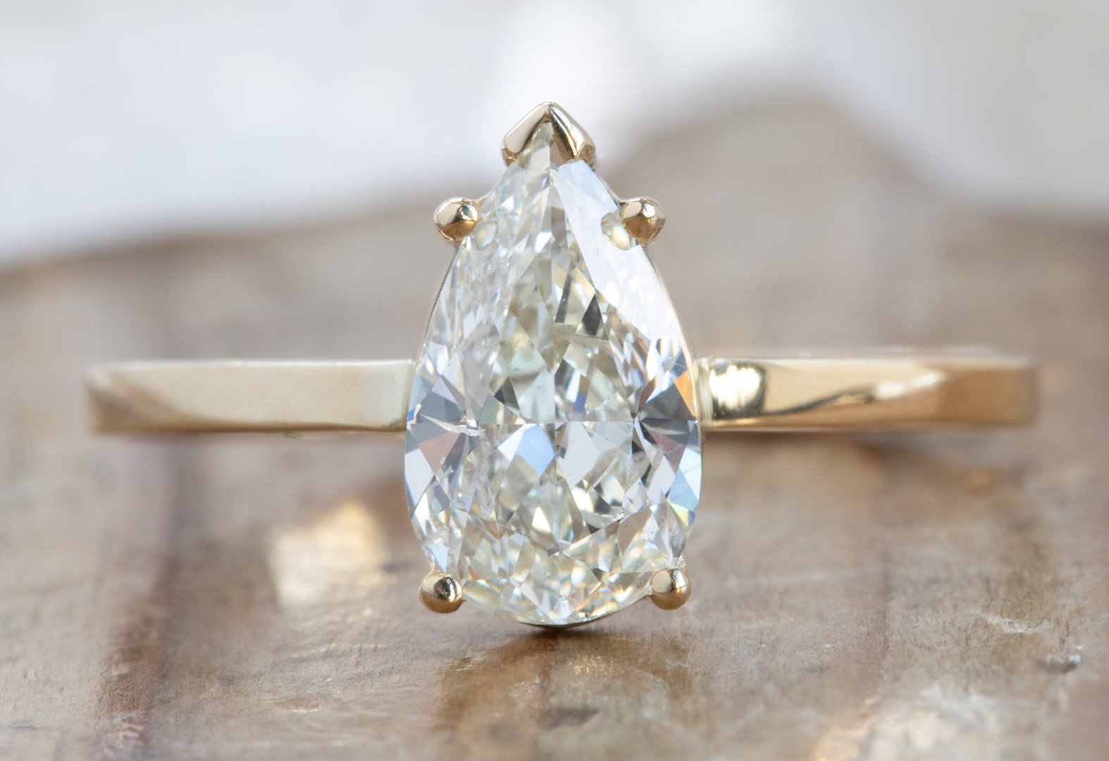 Alexis Russell - The Aster Ring with A Pear-Cut White Diamond