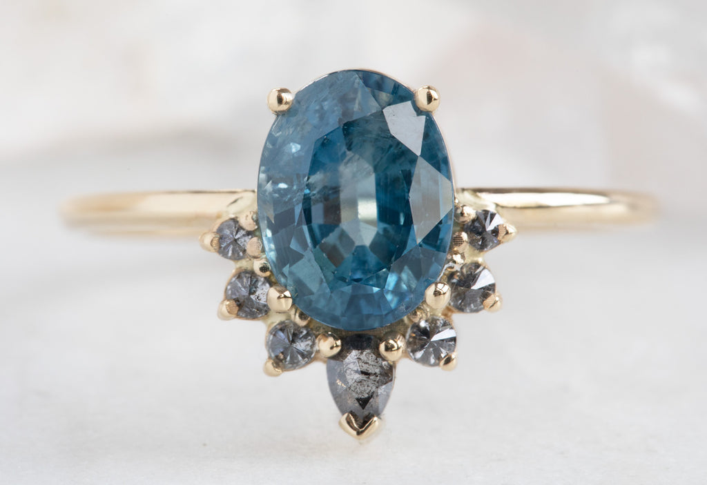 Oval Cut Sapphire Engagement Ring with Attached Diamond Sunburst