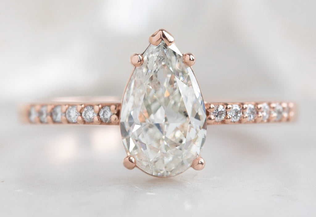 One Of A Kind Pear Cut White Diamond Engagement Ring with Pavé Band