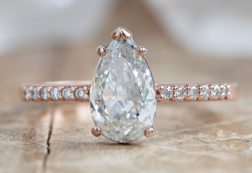 One Of A Kind Pear Cut White Diamond Engagement Ring with Pavé Band