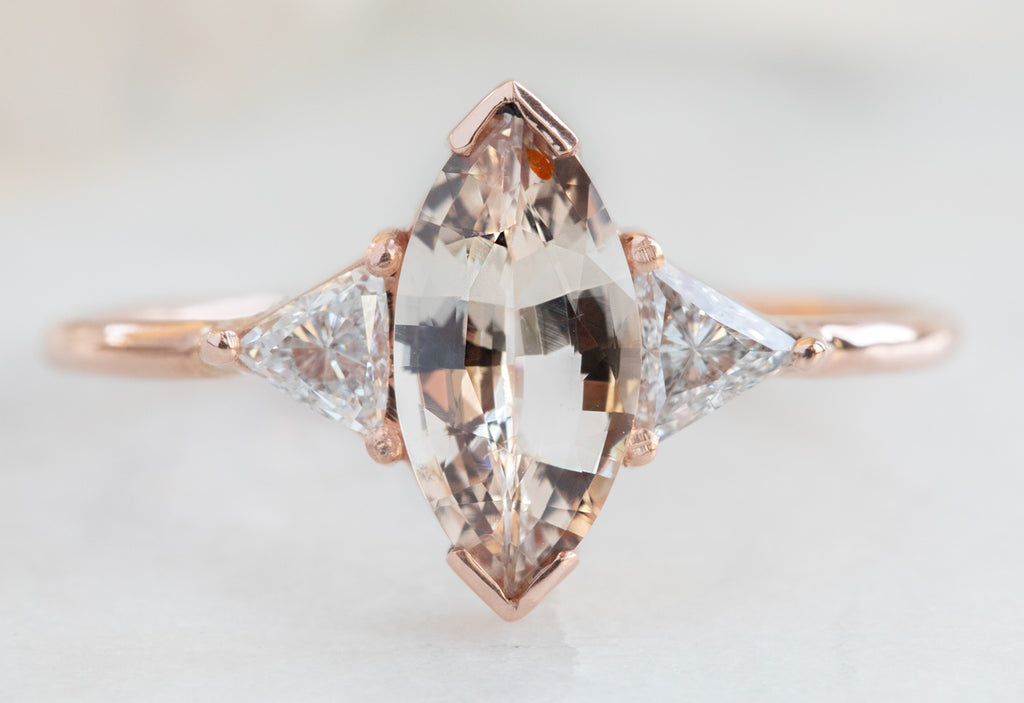 Three Stone Peach Sapphire + Diamond Engagement Ring