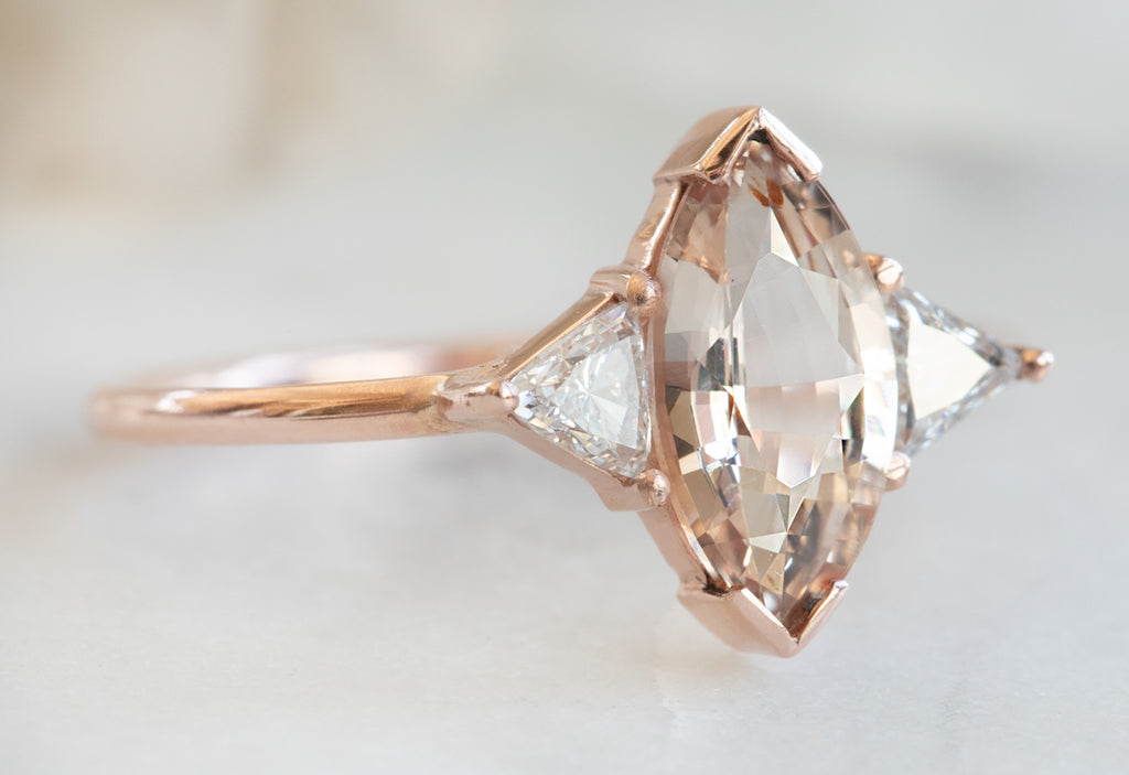 Three Stone Peach Sapphire + Diamond Engagement Ring