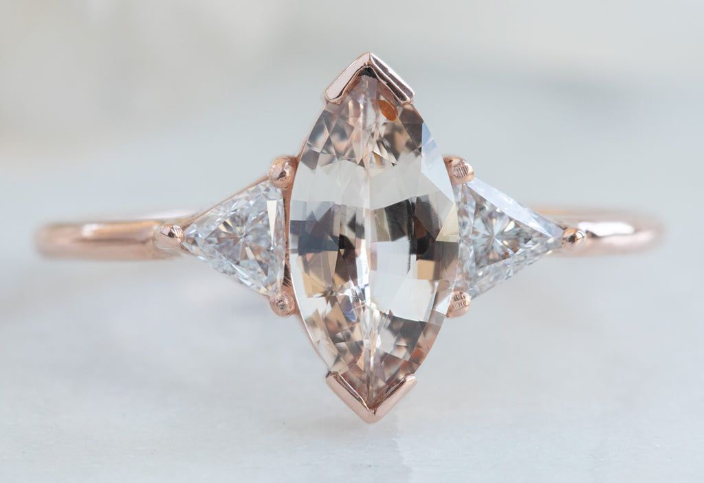 Three Stone Peach Sapphire + Diamond Engagement Ring