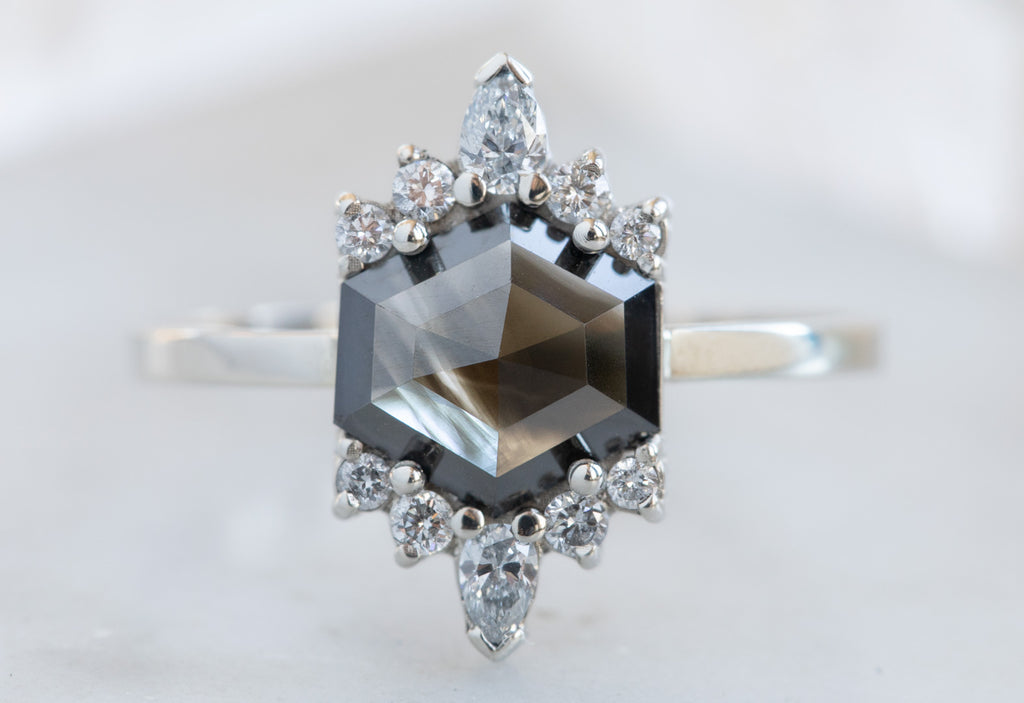 Hexagon-Cut Opalescent Black Diamond Engagement Ring with White Sunbursts