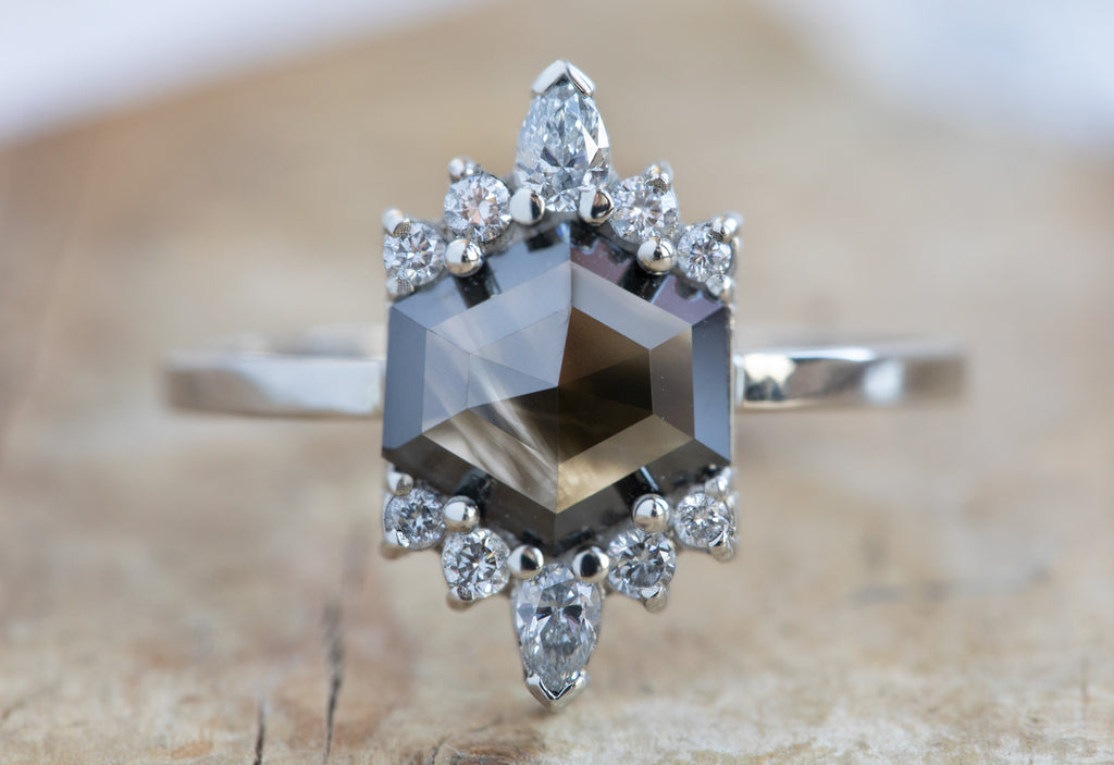 Hexagon-Cut Opalescent Black Diamond Engagement Ring with White Sunbursts