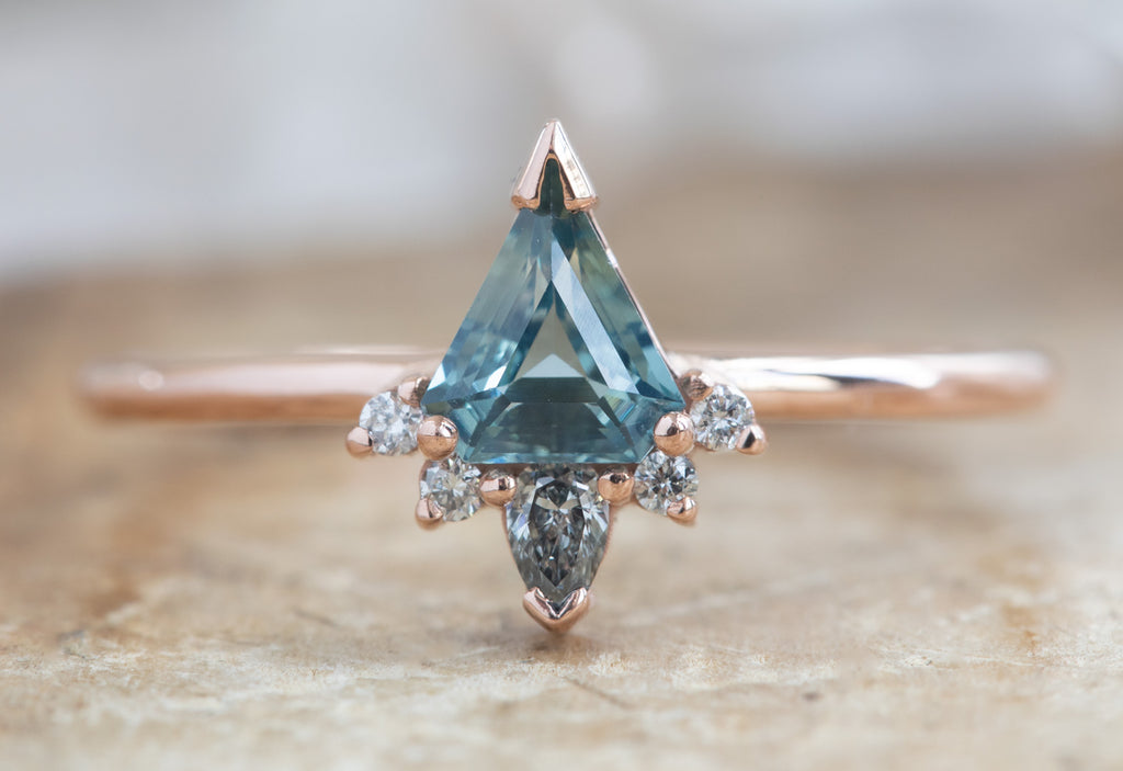 Shield Cut Sapphire Engagement Ring with Attached Diamond Sunburst