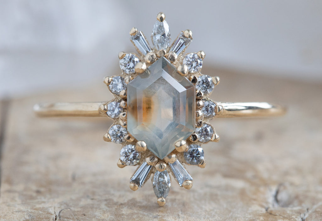The Camellia Ring with a Hexagon-Cut Sapphire