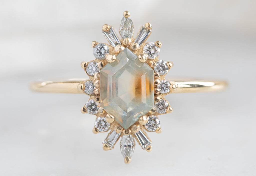 The Camellia Ring with a Hexagon-Cut Sapphire
