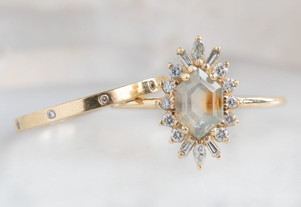 The Camellia Ring with a Hexagon-Cut Sapphire