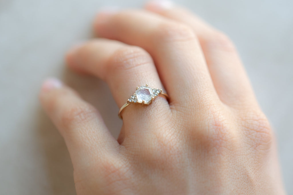 The Ivy Ring with a White Hexagon Diamond on hand
