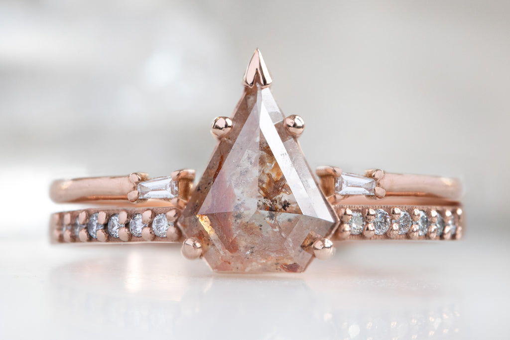 The Willow Ring with a Shield Cut Red Diamond with Open Cuff Baguette Diamond stacking band
