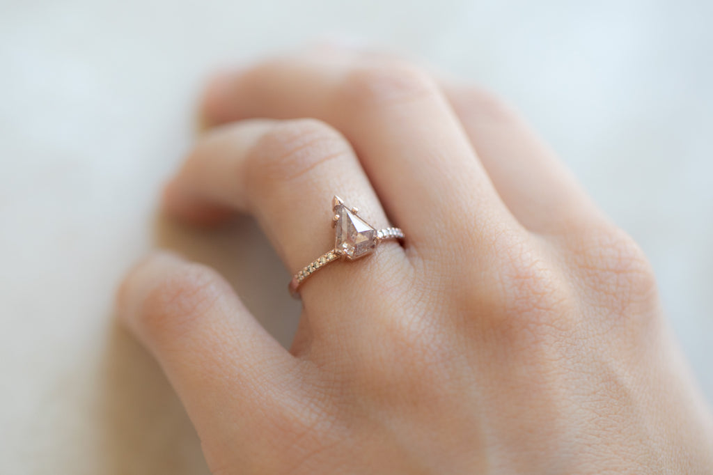 The Willow Ring with a Shield Cut Red Diamond on hand