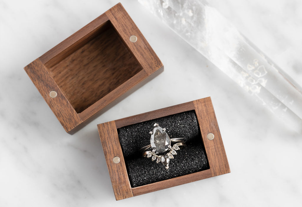 Handcrafted Black Walnut Ring Box Open with White Gold Diamond Engagement Ring and Sunburst Stacking Band inside