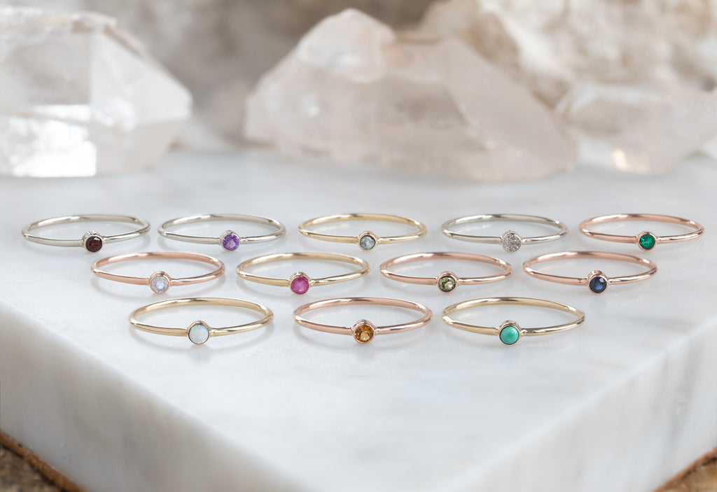 Custom Birthstone Stacking Rings on Marble