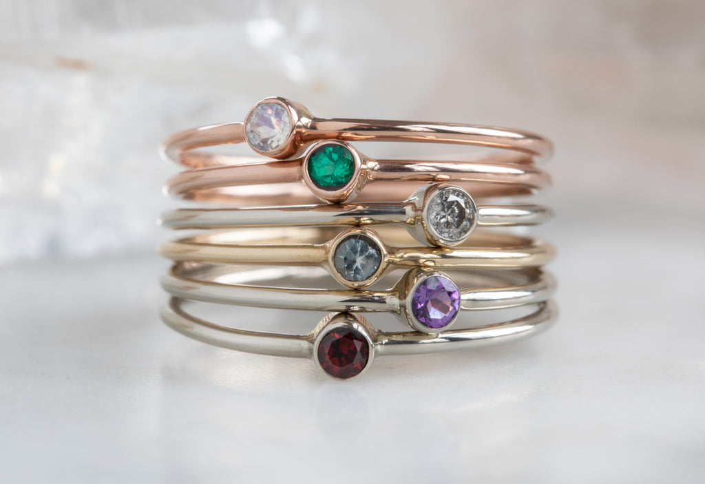 Custom Birthstone Stacking Rings Stacked on Top of Each Other