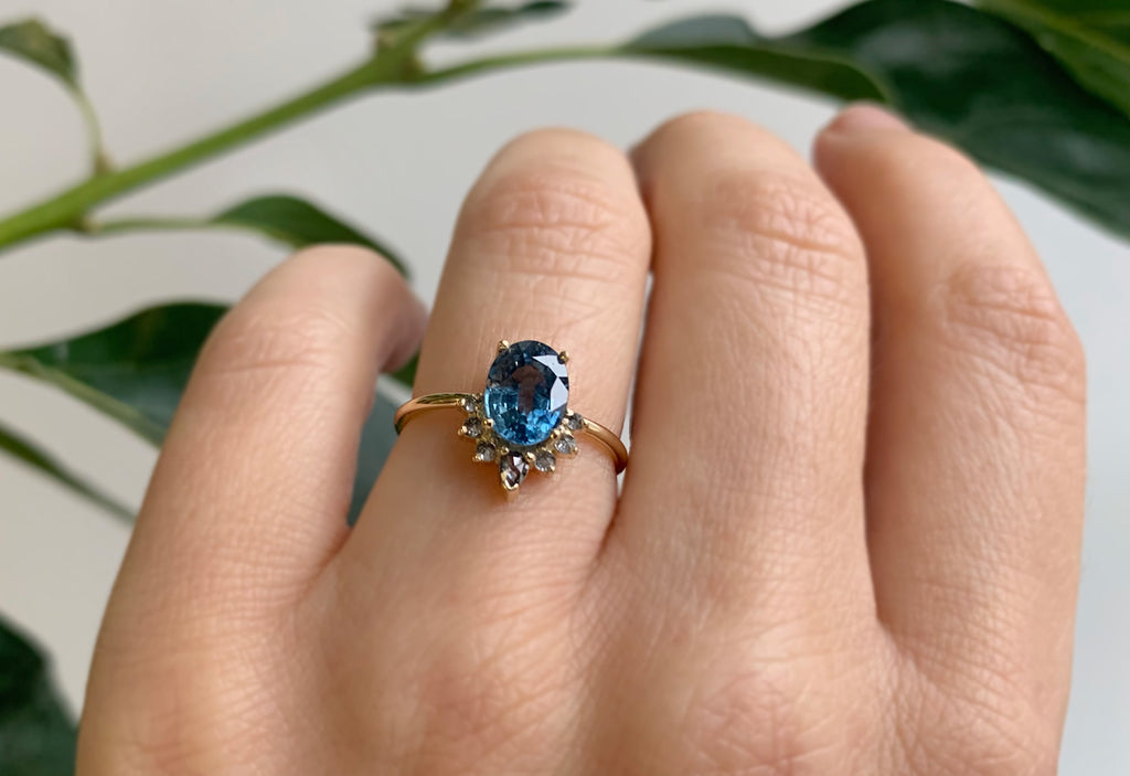 Oval Cut Sapphire Engagement Ring with Attached Diamond Sunburst