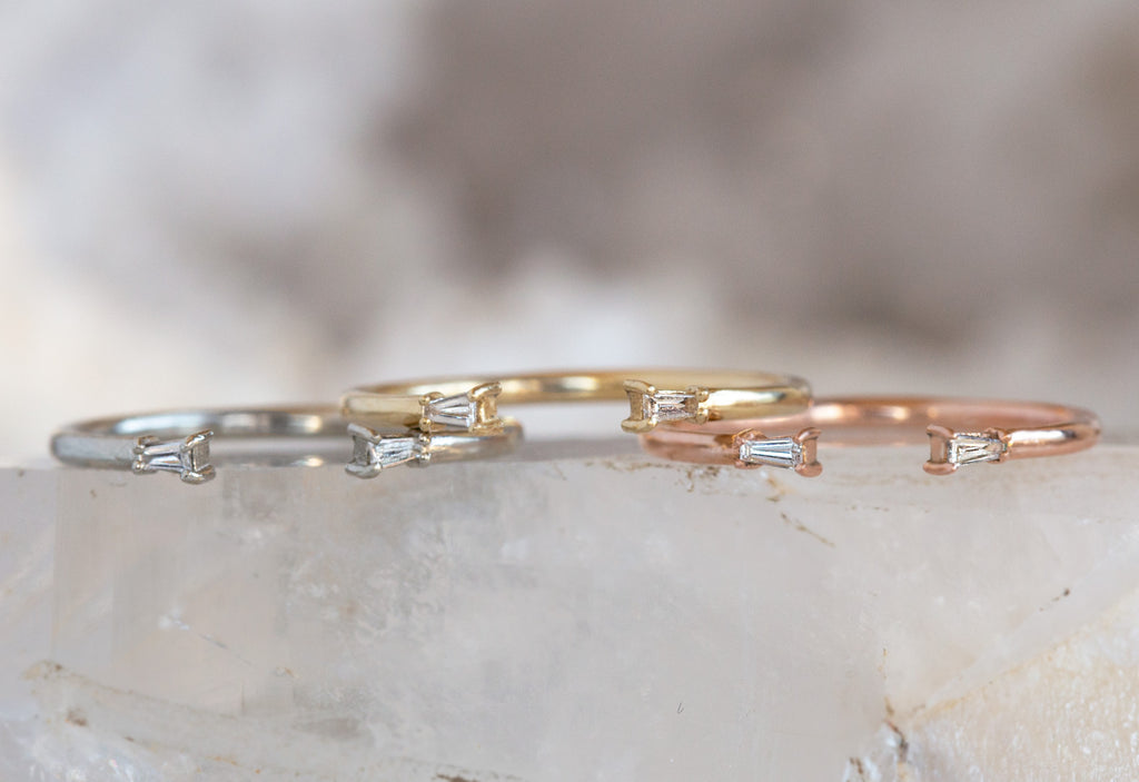 Three Open Cuff Baguette Diamond Rings in White, Yellow and Rose Gold on Crystal