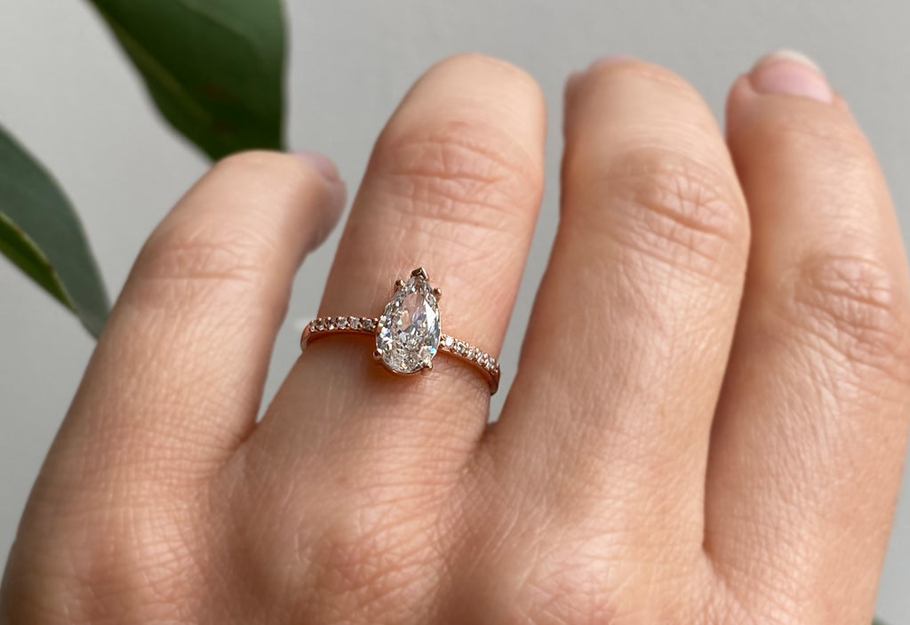 One Of A Kind Pear Cut White Diamond Engagement Ring with Pavé Band