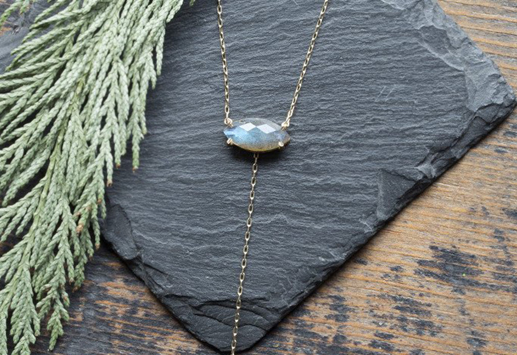 Labradorite Marquise Lariat Necklace on Slate Rock with Pine Needles