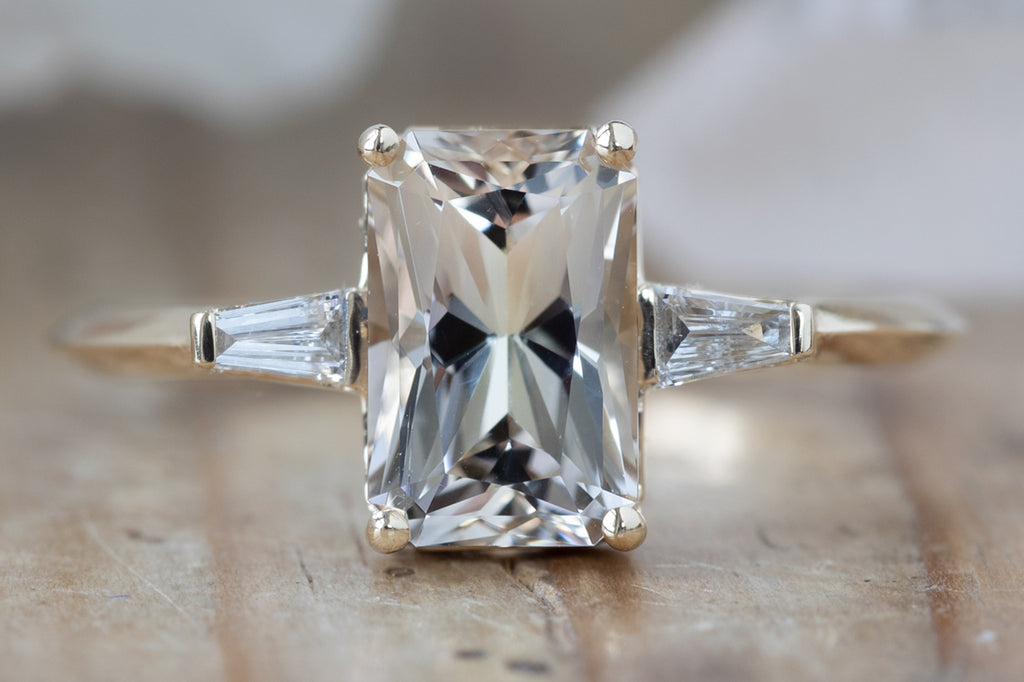 The Ash Ring with an Emerald Cut Champagne Sapphire