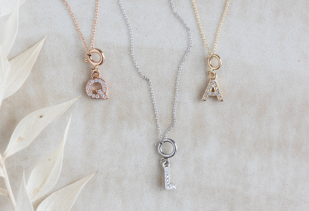 "Q", "L" and "A" pavé diamond charm necklaces