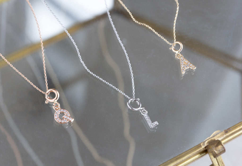 "Q", "L" and "A" pavé diamond charm necklaces