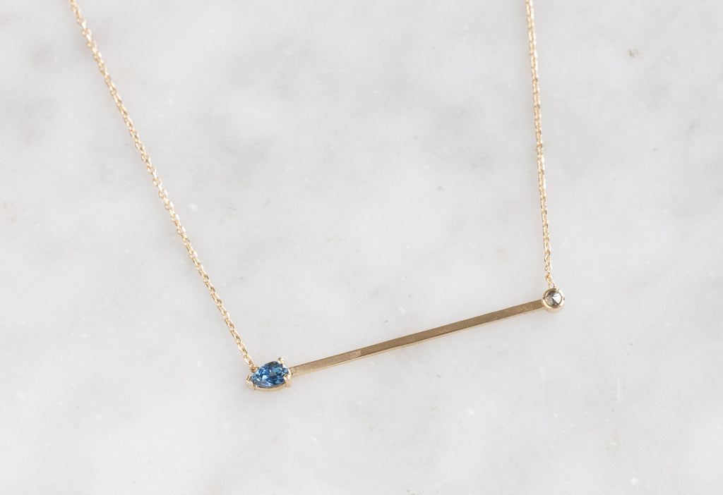 Montana Sapphire + Diamond Necklace on Marble